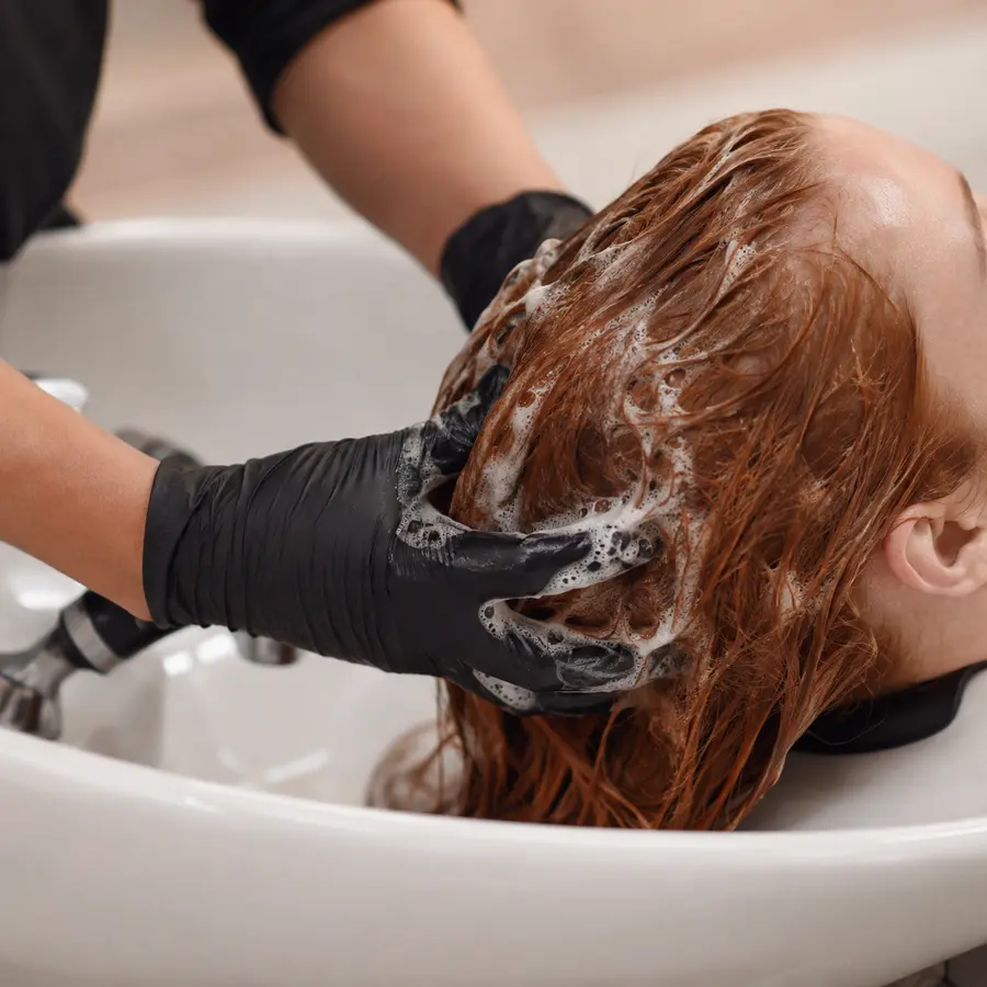 Color care cleansing routine at a salon wash basin