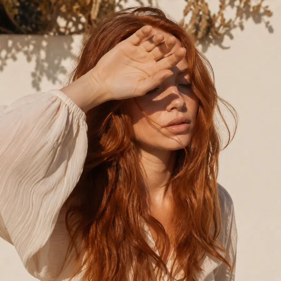 Color-treated copper hair exposed to sunlight