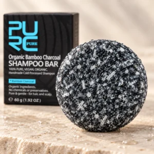 Close-up of PURC Bamboo Charcoal Shampoo Bar texture with water droplets