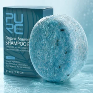 Close-up of the textured blue PURC Bio Seaweed Shampoo Bar with water droplets