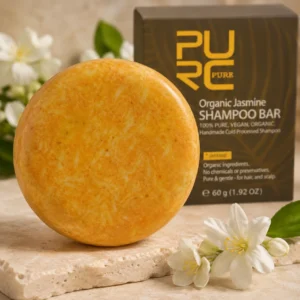 Close-up showing PURC Jasmine Shampoo Bar texture and jasmine flowers