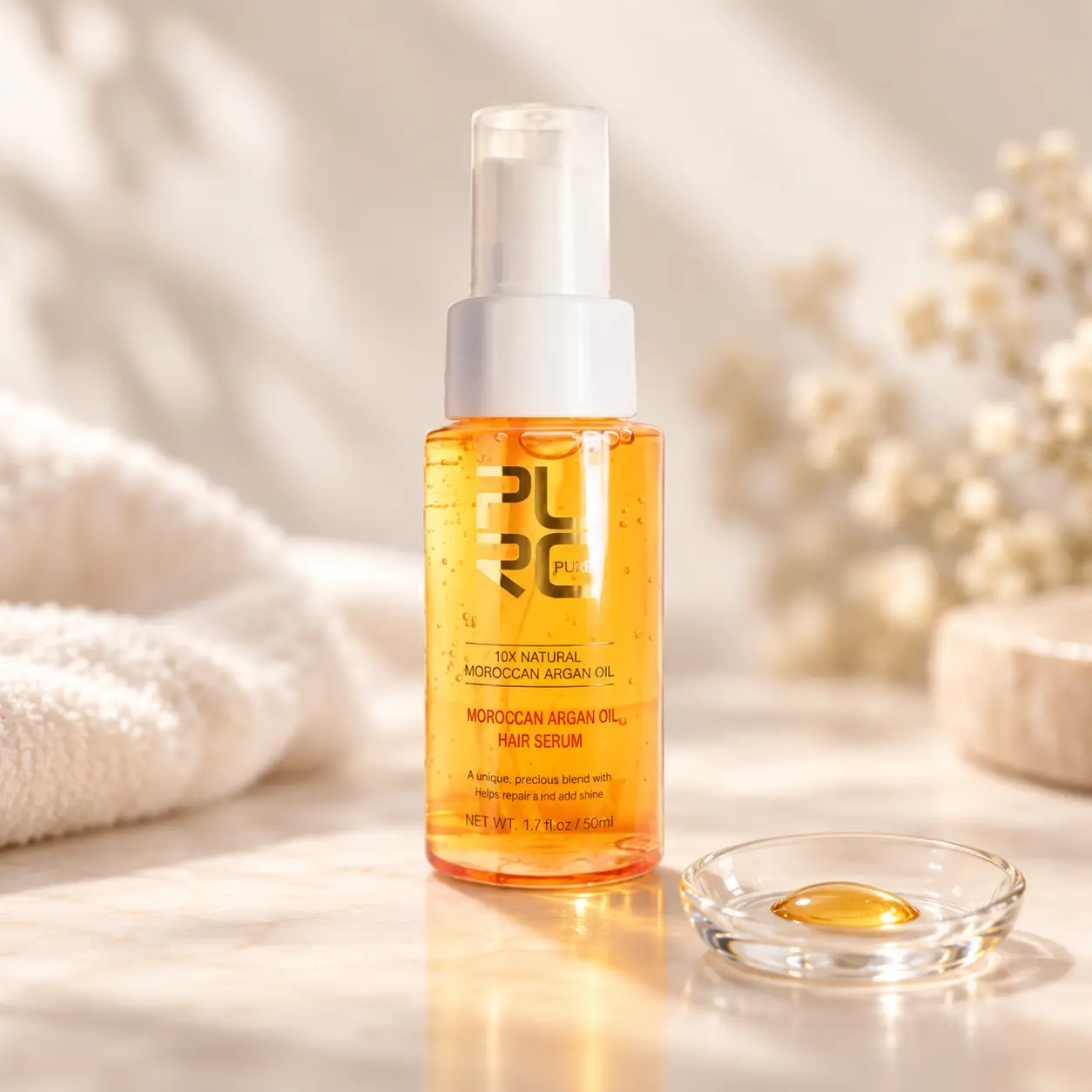 PURC Moroccan Argan Oil Hair Serum texture with a single amber serum drop beside the 50 ml bottle