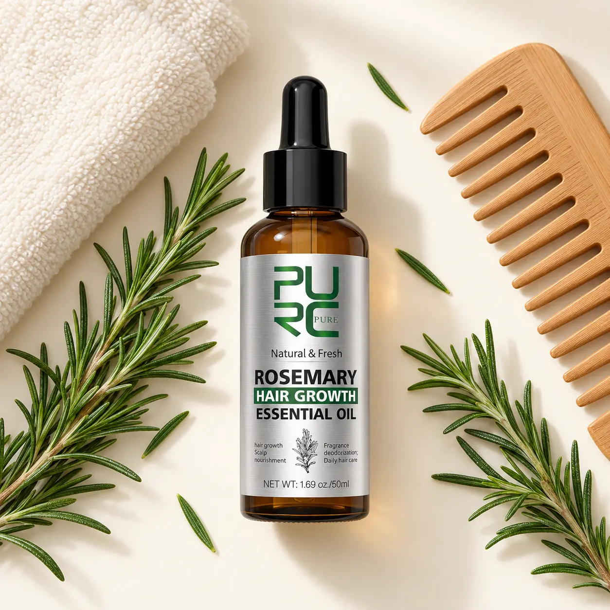 PURC Rosemary Hair Growth Essential Oil flat lay with rosemary, towel and wooden comb