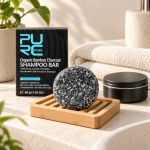 PURC Bamboo Charcoal Shampoo Bar drying on a draining bamboo soap dish