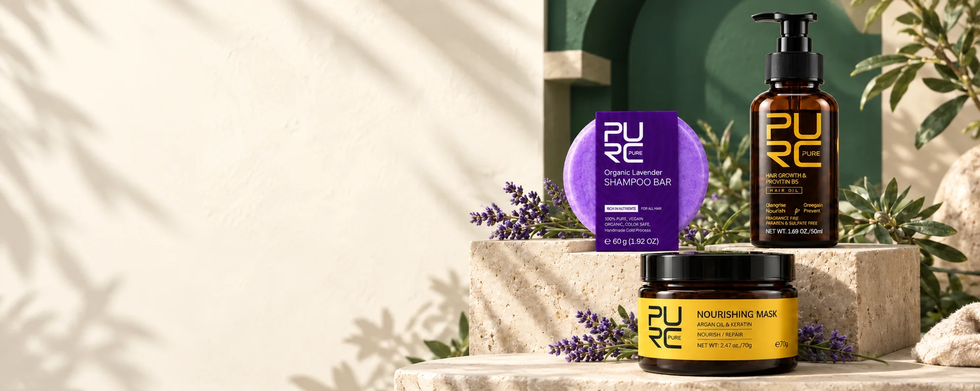 PURC lavender shampoo bar, hair oil and nourishing hair mask on stone display stands